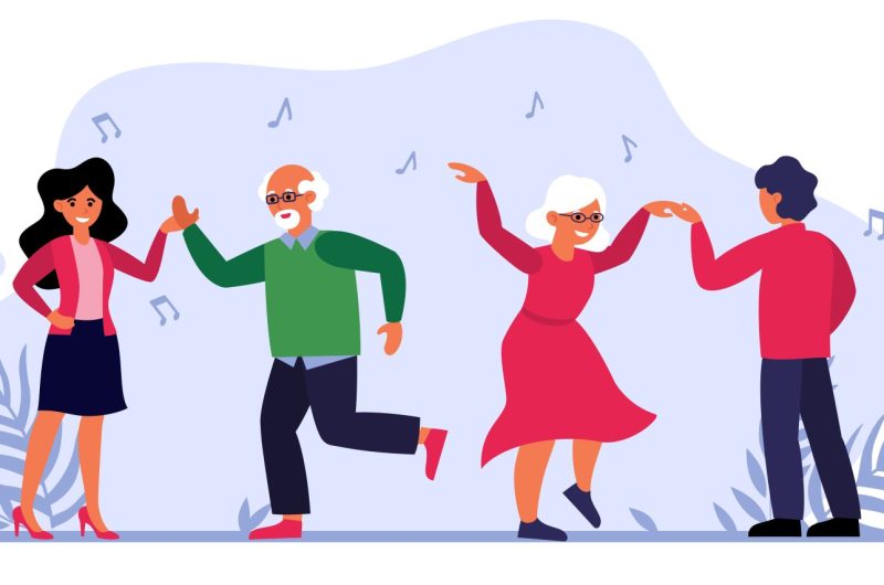 Senior couple dancing with young people